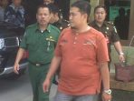 wpid-PLT-Sekda-Muratara-saat-digiring-pihak-kejaksaan..jpg