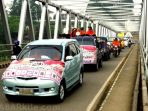 wpid-peserta-kirab-pemilu-damai-di-kabupaten-empat-lawang-melintasi-jembatan-musi-menuju-kantor-kpu-empa.jpg