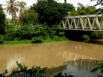 wpid-tampak-sungai-enim-berubah-coklat-terindikasi-limbah-tambang-1_kbr.jpg